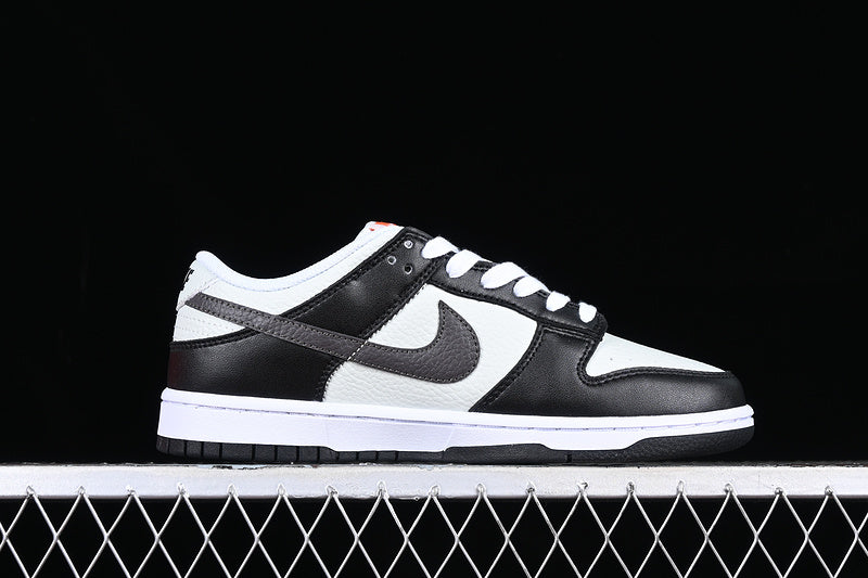 Nike Dunk Low
Black Total Orange Mini Swoosh